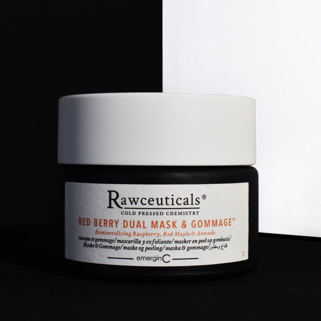 Red Berry Dual Mask & Gommage A jar of face mask sitting on top of a table.