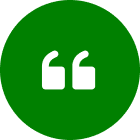 A green circle with two white quotation marks.