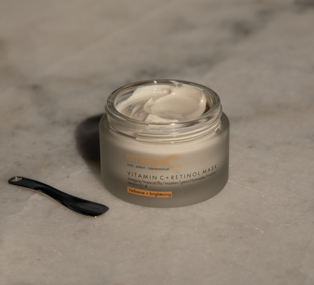 vitamin c and retinol mask1 A jar of cream sitting on top of a counter.