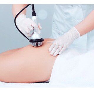 Cavitation with skin tightening A person is getting their leg waxed