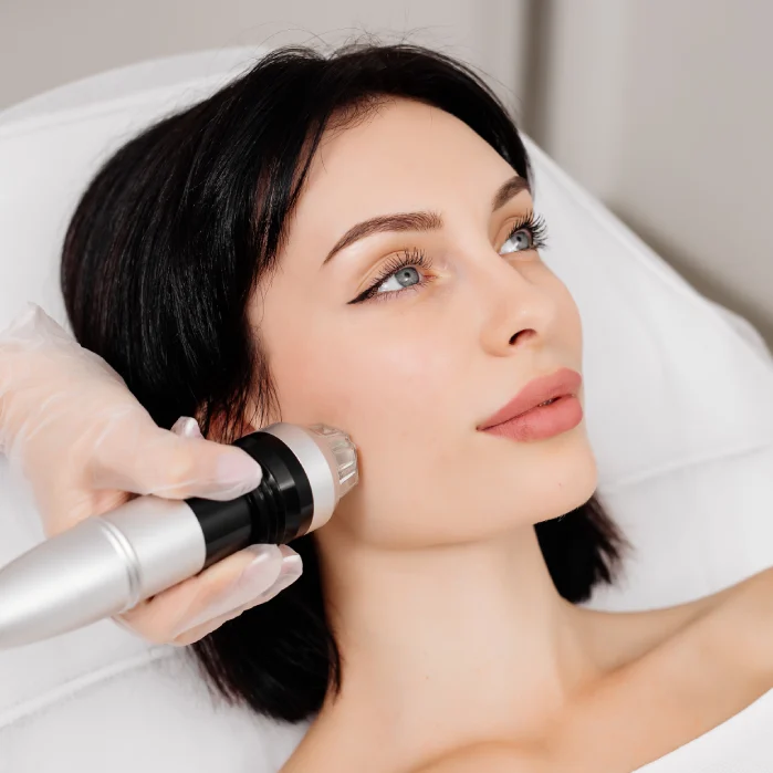 A woman getting her face and neck hair shaved