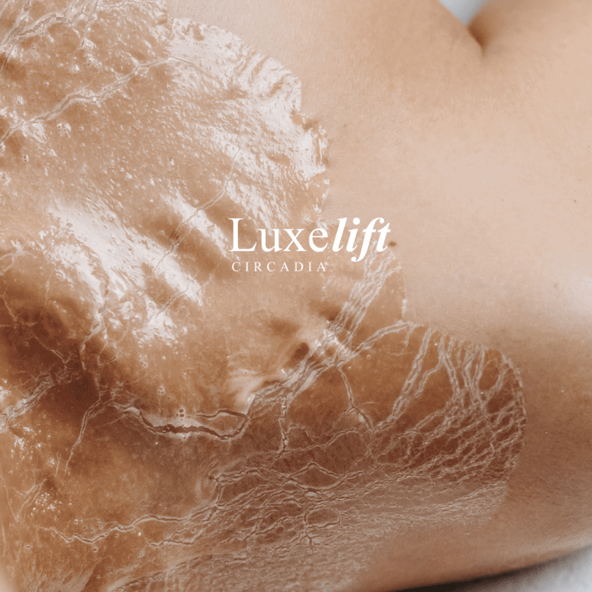 Luxe Lift Facial Image A woman 's breast and stomach in the sand.