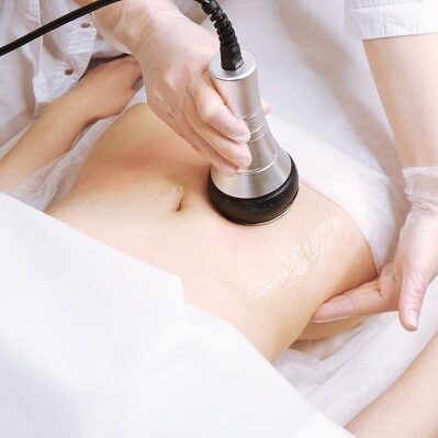 A person is getting their body scanned with an ultrasound machine.
